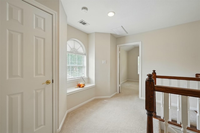4027 Austin Meadow Dr, Sugar Land, TX 77479 - hallway with light colored carpet, baseboards, and an upstairs landing