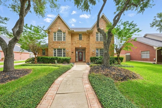 4027 Austin Meadow Dr, Sugar Land, TX 77479 - traditional-style home featuring brick siding