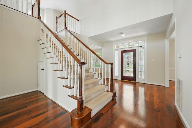 4027 Austin Meadow Dr, Sugar Land, TX 77479 - foyer featuring stairs, hardwood / wood-style floors, a towering ceiling, and baseboards