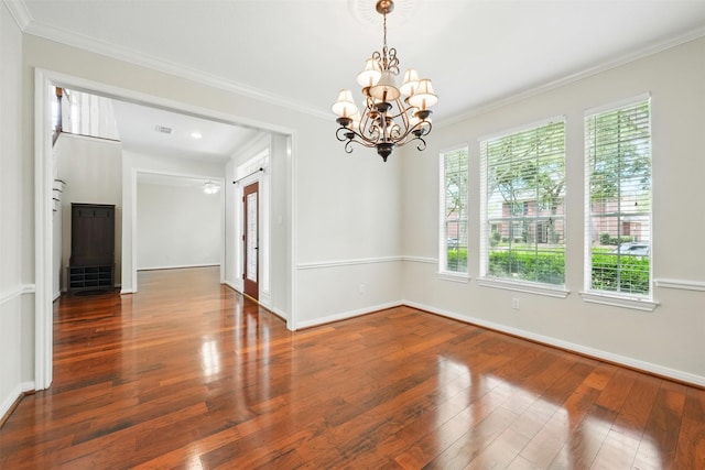 4027 Austin Meadow Dr, Sugar Land, TX 77479 - empty room featuring plenty of natural light, wood finished floors, crown molding, a chandelier, and baseboards