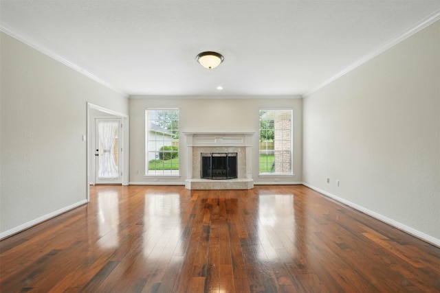 4027 Austin Meadow Dr, Sugar Land, TX 77479 - unfurnished living room featuring ornamental molding, hardwood / wood-style floors, baseboards, and a high end fireplace