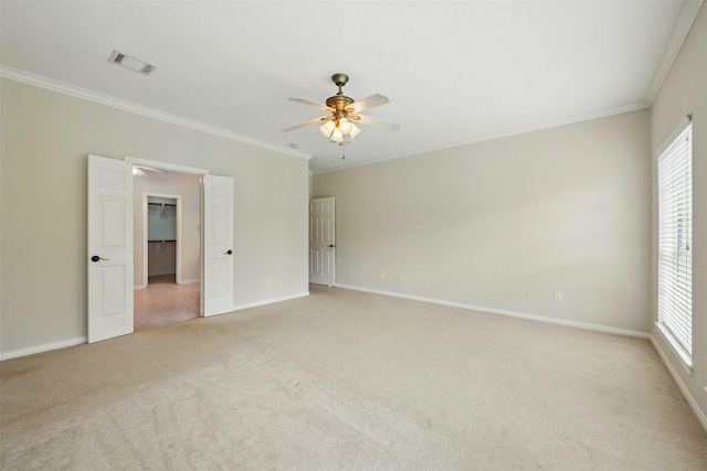 4027 Austin Meadow Dr, Sugar Land, TX 77479 - empty room featuring crown molding, a ceiling fan, light carpet, and baseboards