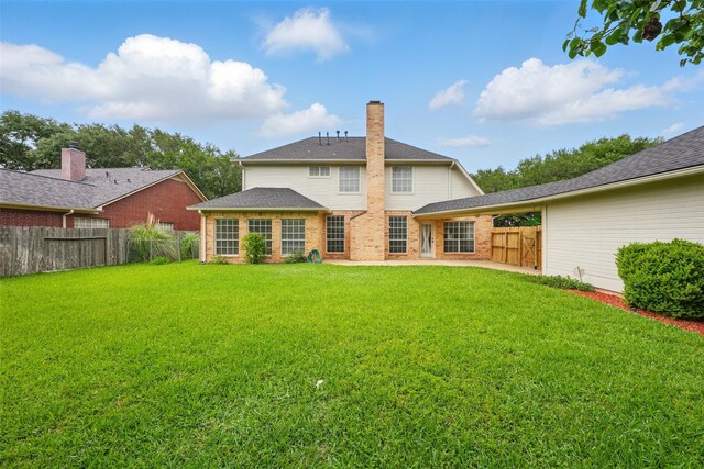 4027 Austin Meadow Dr, Sugar Land, TX 77479 - back of property with brick siding and a chimney