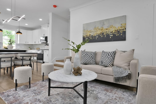 living room featuring light wood-type flooring and recessed lighting