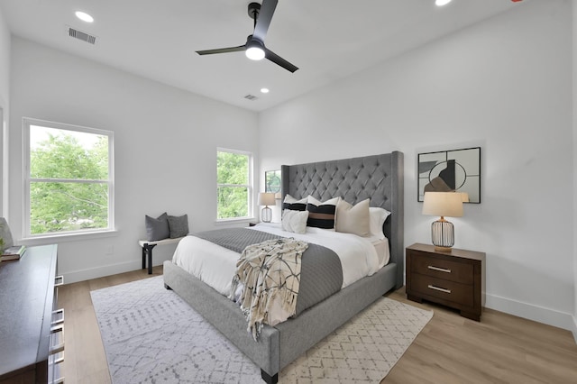 bedroom featuring baseboards, light wood-style flooring, recessed lighting, and ceiling fan