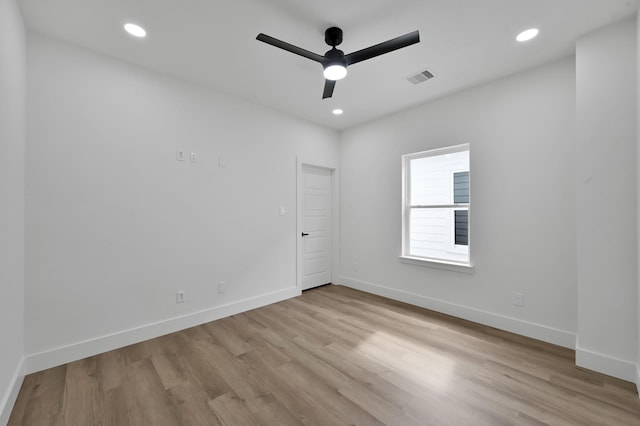 spare room featuring ceiling fan, light wood-style floors, baseboards, and recessed lighting