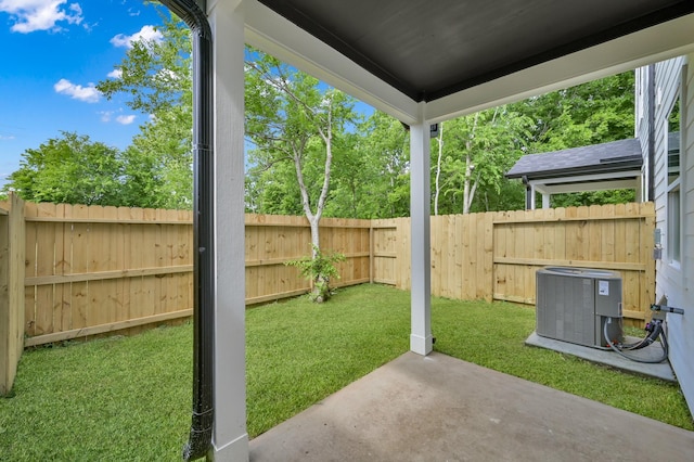 view of yard featuring cooling unit and a patio area