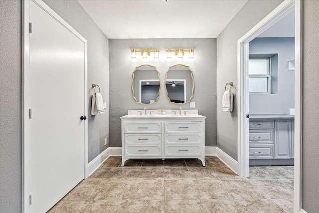 20316 County Road 510b, Brazoria, TX 77422 - full bathroom featuring double vanity and baseboards
