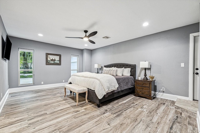 20316 County Road 510b, Brazoria, TX 77422 - bedroom with light wood-type flooring, baseboards, a ceiling fan, and recessed lighting