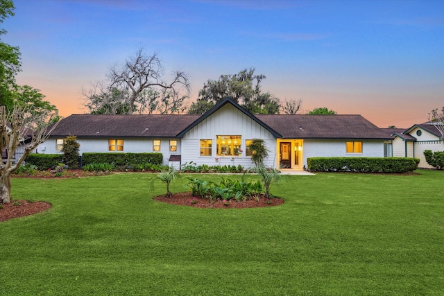20316 County Road 510b, Brazoria, TX 77422 - view of front of house with board and batten siding and a yard