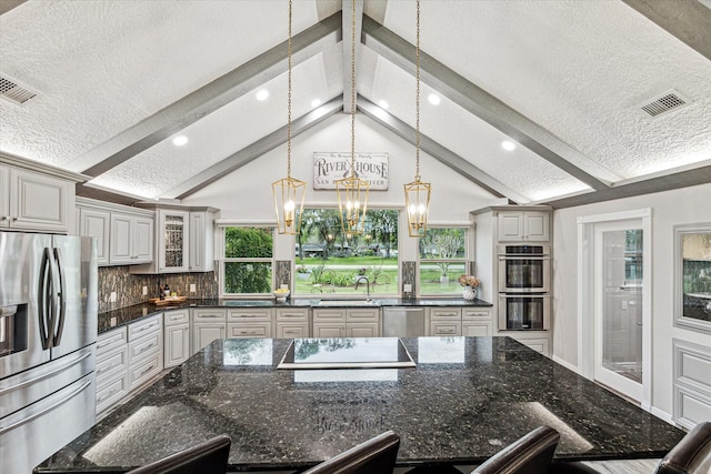 20316 County Road 510b, Brazoria, TX 77422 - kitchen featuring appliances with stainless steel finishes, a textured ceiling, pendant lighting, recessed lighting, and tasteful backsplash