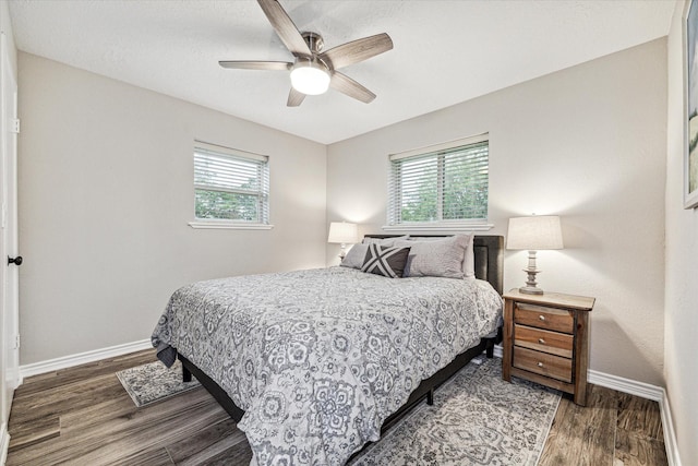 20316 County Road 510b, Brazoria, TX 77422 - bedroom featuring baseboards, wood finished floors, and a ceiling fan
