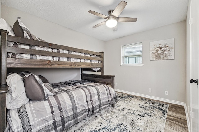 20316 County Road 510b, Brazoria, TX 77422 - bedroom featuring baseboards, wood finished floors, and ceiling fan
