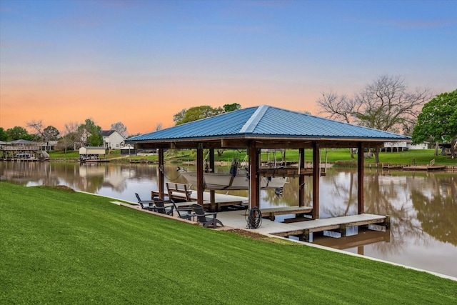 20316 County Road 510b, Brazoria, TX 77422 - dock with boat lift, a yard, and a water view