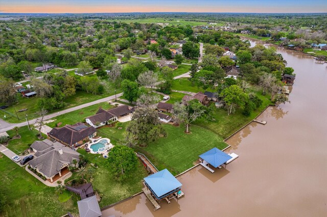 20316 County Road 510b, Brazoria, TX 77422 - aerial overview of property's location featuring a large body of water and a tree filled landscape