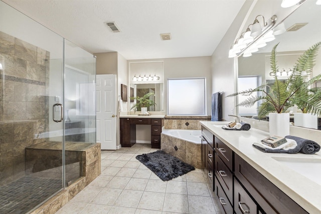 11405 Starlight Bay St, Pearland, TX 77584 - bathroom featuring a garden tub, a shower stall, tile patterned floors, and double vanity