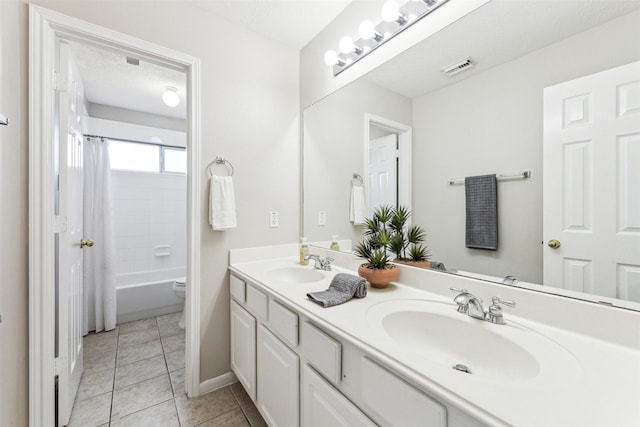 11405 Starlight Bay St, Pearland, TX 77584 - bathroom featuring tile patterned floors, double vanity, baseboards, shower / bath combination with curtain, and toilet