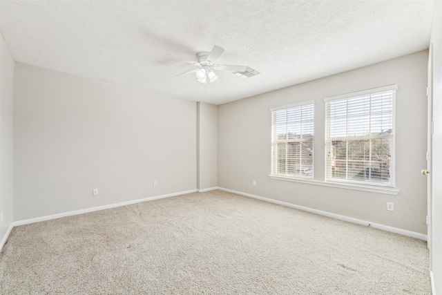 11405 Starlight Bay St, Pearland, TX 77584 - spare room featuring a ceiling fan, carpet flooring, baseboards, and a textured ceiling