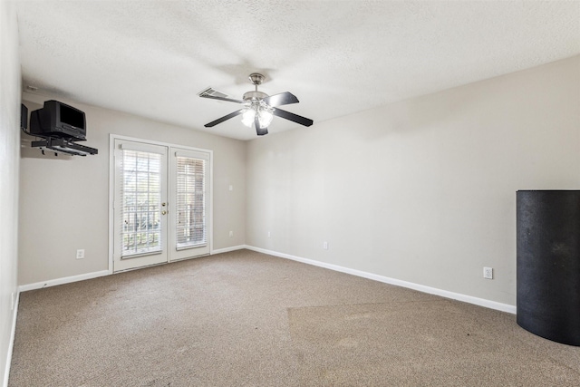 11405 Starlight Bay St, Pearland, TX 77584 - unfurnished room featuring ceiling fan, baseboards, carpet, a textured ceiling, and french doors