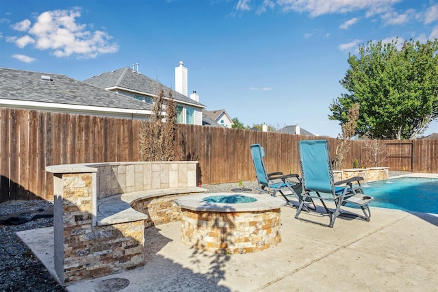 11405 Starlight Bay St, Pearland, TX 77584 - view of patio / terrace featuring an outdoor fire pit and a fenced backyard