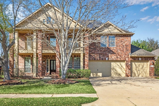 11405 Starlight Bay St, Pearland, TX 77584 - view of front facade with a balcony, brick siding, driveway, and a garage