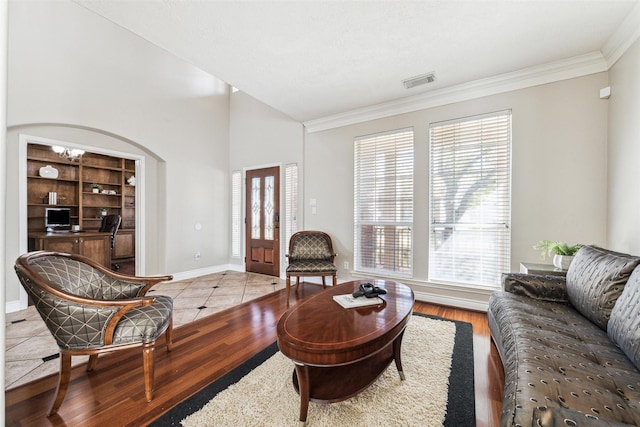 11405 Starlight Bay St, Pearland, TX 77584 - living room featuring an office area, crown molding, healthy amount of natural light, baseboards, and light wood-style floors