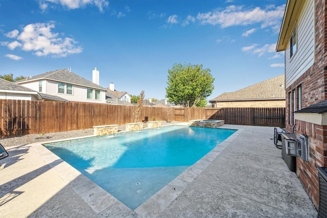 11405 Starlight Bay St, Pearland, TX 77584 - view of swimming pool with a fenced backyard, a patio area, and a pool with connected hot tub