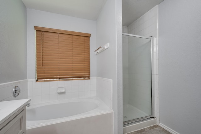 4523 Bridgevillage Dr, Spring, TX 77373 - bathroom featuring a shower stall, a bath, and vanity