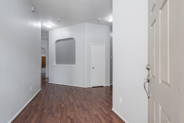 4523 Bridgevillage Dr, Spring, TX 77373 - hallway with wood finished floors, baseboards, and arched walkways