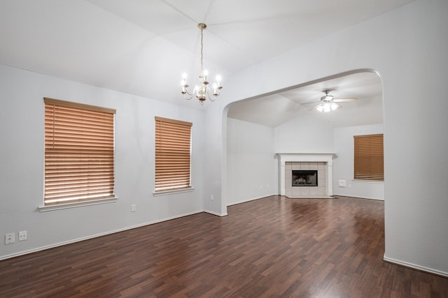 4523 Bridgevillage Dr, Spring, TX 77373 - unfurnished living room featuring vaulted ceiling, arched walkways, wood finished floors, ceiling fan, and a chandelier