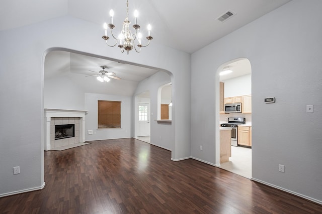 4523 Bridgevillage Dr, Spring, TX 77373 - unfurnished living room featuring vaulted ceiling, a ceiling fan, wood finished floors, a chandelier, and a fireplace