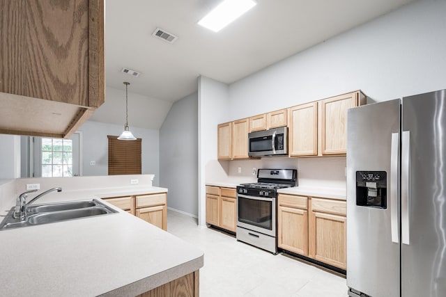 4523 Bridgevillage Dr, Spring, TX 77373 - kitchen with stainless steel appliances, a sink, light brown cabinetry, vaulted ceiling, and light floors