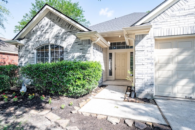 4523 Bridgevillage Dr, Spring, TX 77373 - doorway to property featuring an attached garage, a shingled roof, and stone siding