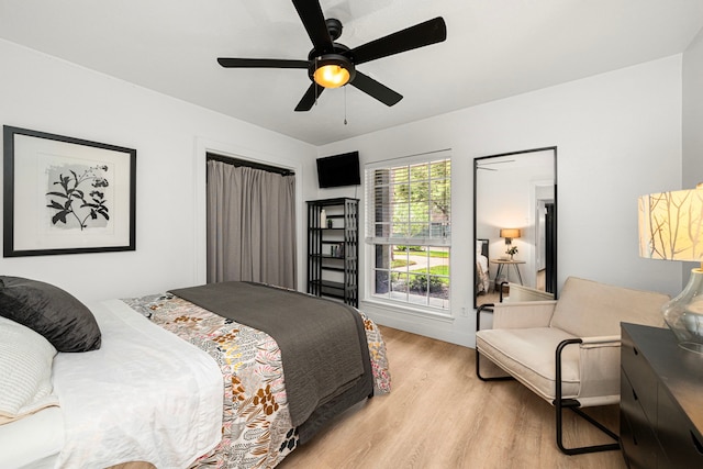 13919 Kimberley Ln, Houston, TX 77079 - bedroom featuring light wood-style floors and ceiling fan
