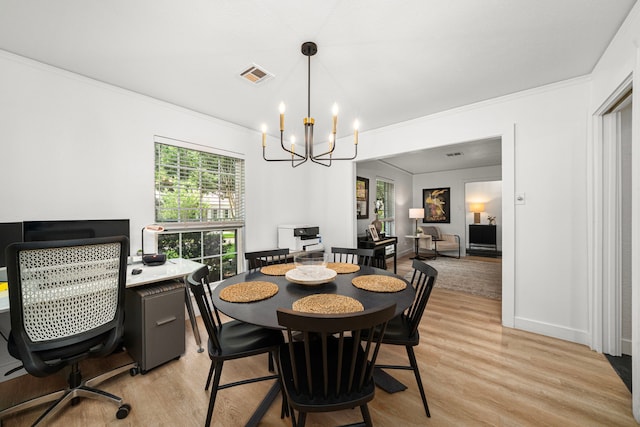 13919 Kimberley Ln, Houston, TX 77079 - dining space with light wood-style flooring, crown molding, a chandelier, a desk, and baseboards