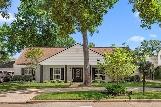 13919 Kimberley Ln, Houston, TX 77079 - view of front of property featuring a front lawn and brick siding