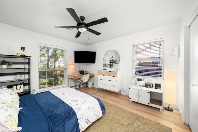 13919 Kimberley Ln, Houston, TX 77079 - bedroom with wood finished floors and a ceiling fan