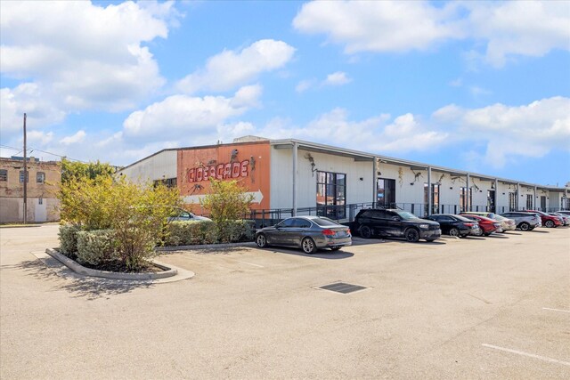 view of commercial location featuring uncovered parking