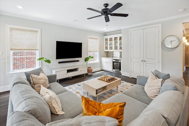 3912 Browning St, West University Place, TX 77005 - living area with beverage cooler, dark wood-style flooring, ornamental molding, baseboards, and a dry bar