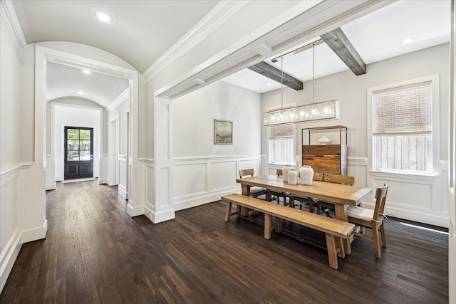 3912 Browning St, West University Place, TX 77005 - dining area with a decorative wall, dark wood-style flooring, arched walkways, beamed ceiling, and a chandelier