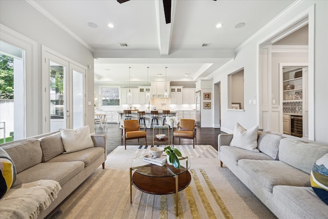 3912 Browning St, West University Place, TX 77005 - living area featuring wine cooler, dark wood finished floors, recessed lighting, beamed ceiling, and ornamental molding