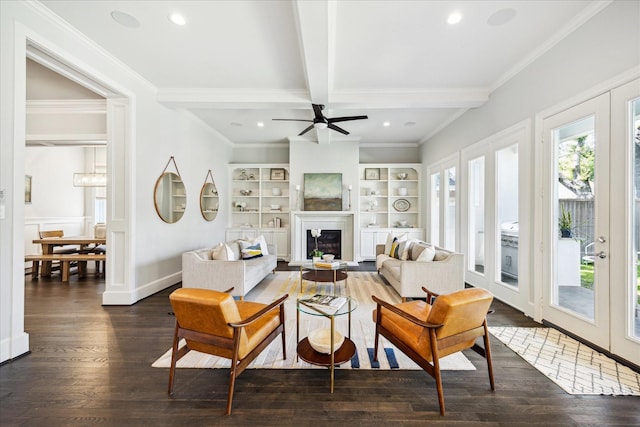 3912 Browning St, West University Place, TX 77005 - living room featuring beam ceiling, crown molding, dark wood-style flooring, a glass covered fireplace, and a ceiling fan