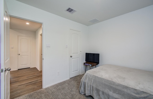 bedroom featuring baseboards, carpet, and recessed lighting