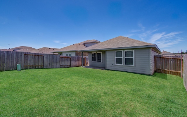 rear view of property with roof with shingles