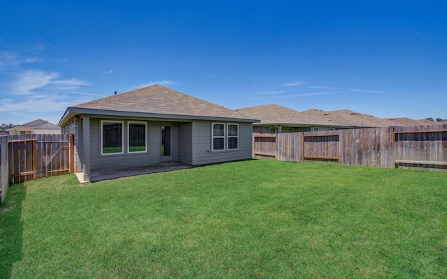 rear view of property with roof with shingles