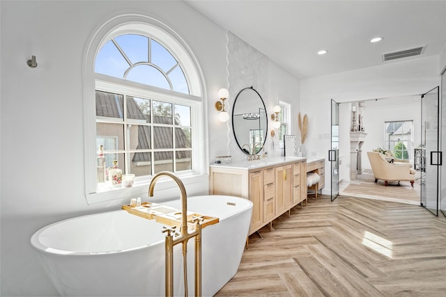 853 Rocky River Rd, Houston, TX 77056 - bathroom with vanity, a soaking tub, recessed lighting, and a fireplace