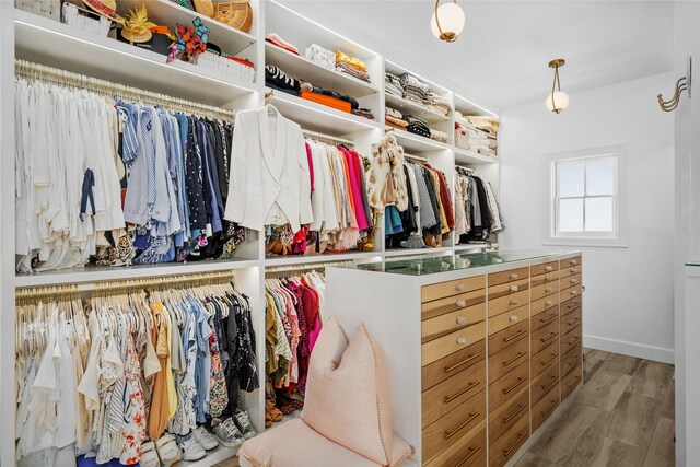853 Rocky River Rd, Houston, TX 77056 - walk in closet featuring wood finished floors