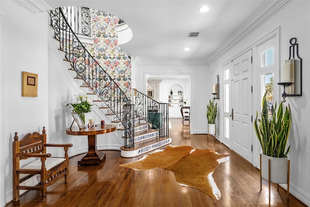 853 Rocky River Rd, Houston, TX 77056 - entryway with stairway, wood finished floors, baseboards, ornamental molding, and recessed lighting