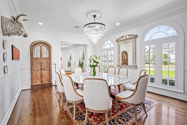 853 Rocky River Rd, Houston, TX 77056 - dining space with dark wood-style floors, a chandelier, crown molding, recessed lighting, and baseboards