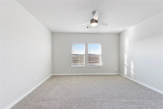 7434 Rivercane Shore Ln, Richmond, TX 77407 - empty room with a ceiling fan, light colored carpet, and baseboards